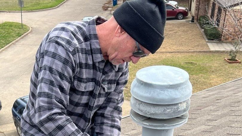 Contractor re-flashing parts of a residential roof that was improperly flashed by a previous contractor.